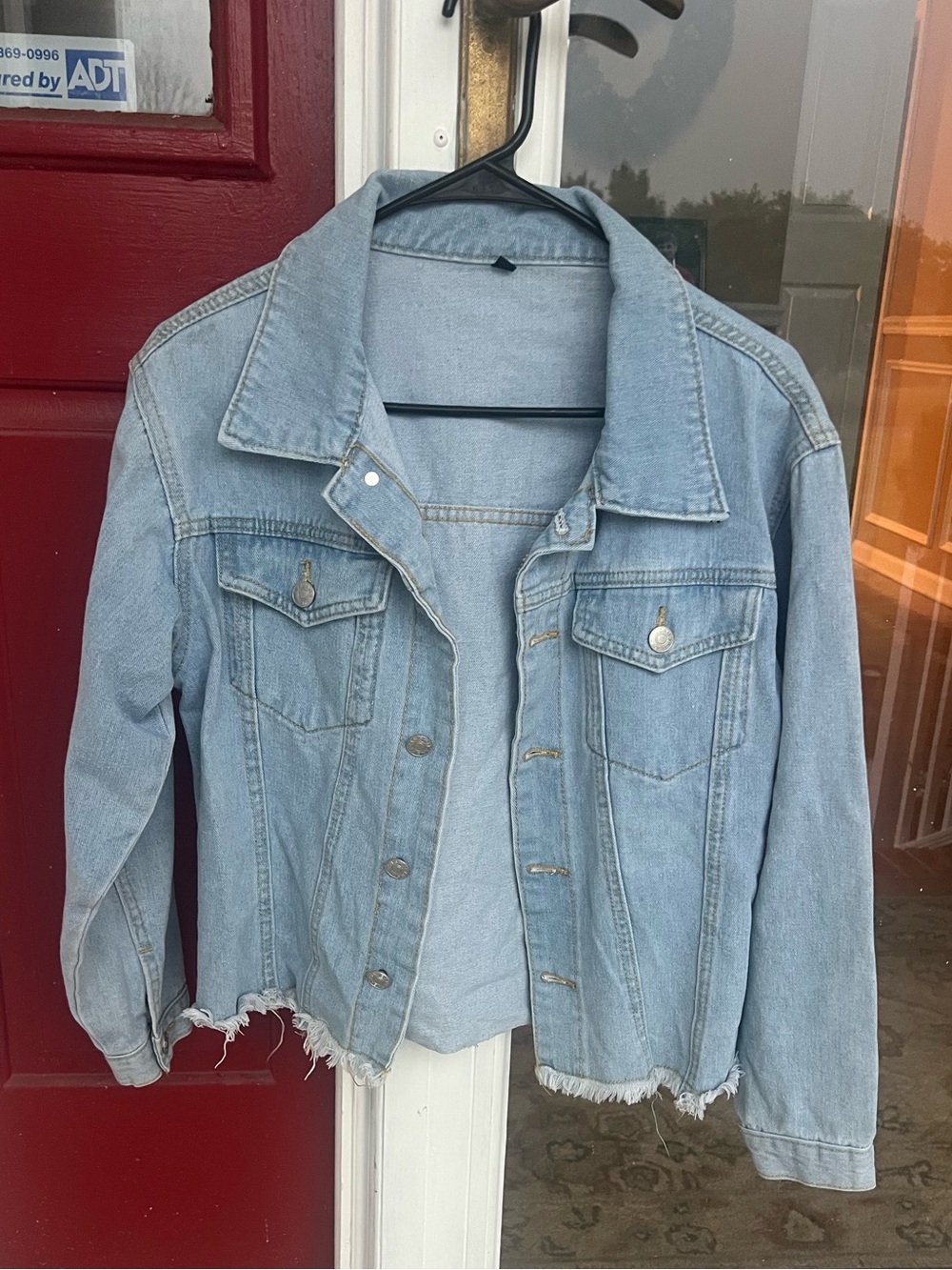 Light Wash Denim Jacket with Frayed Hem